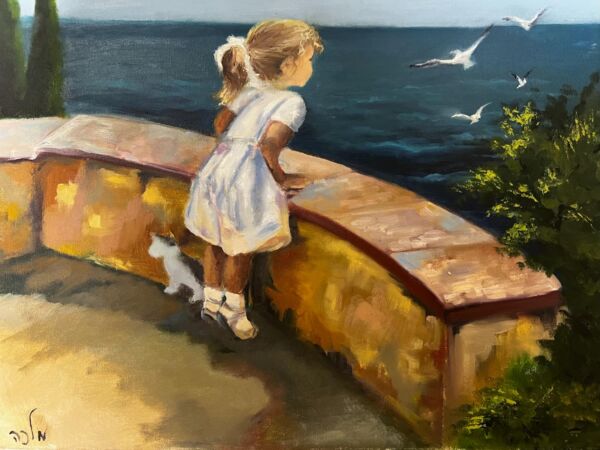 A girl looks at the sea